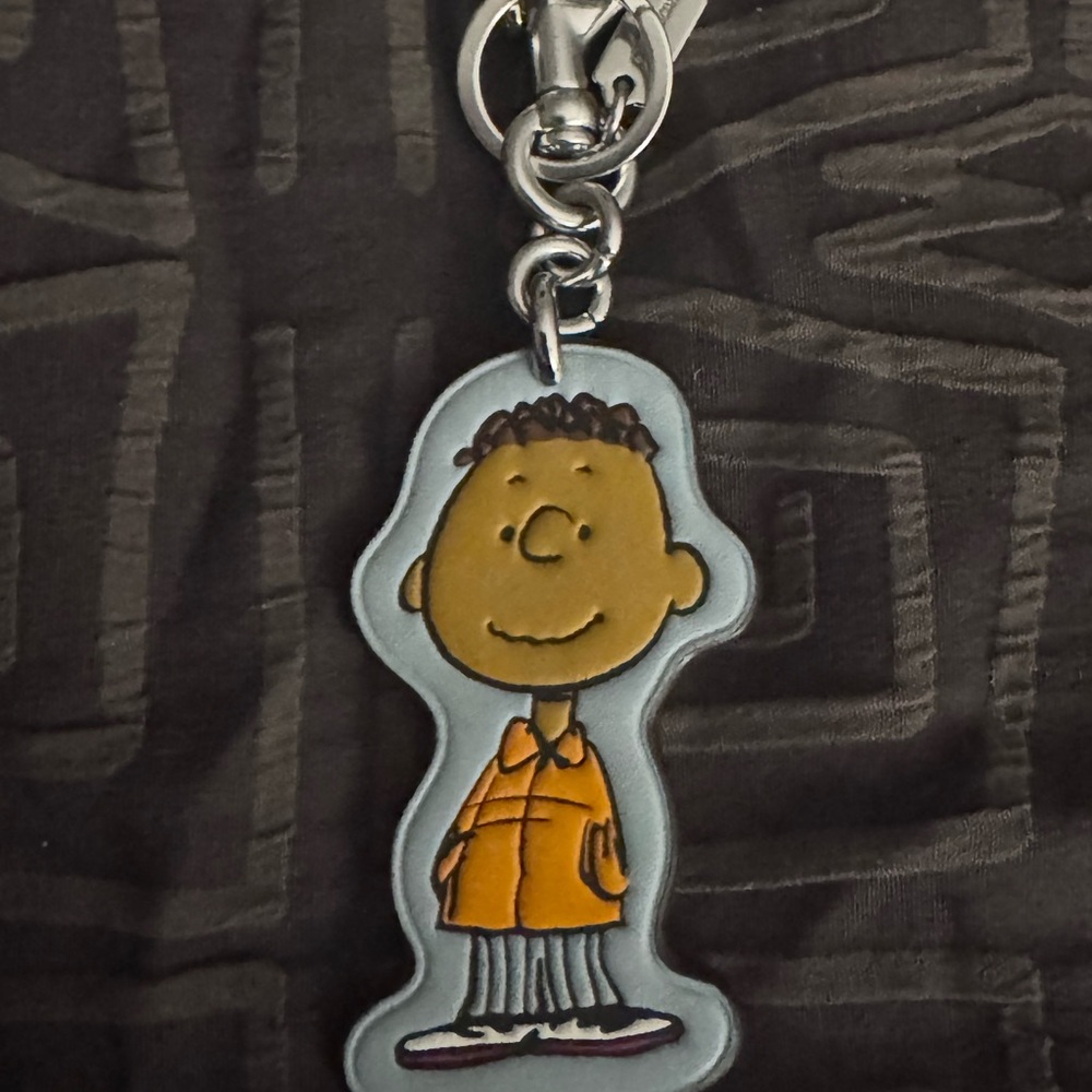 Coach Peanuts Character Keychain - Franklin Orange and Gray